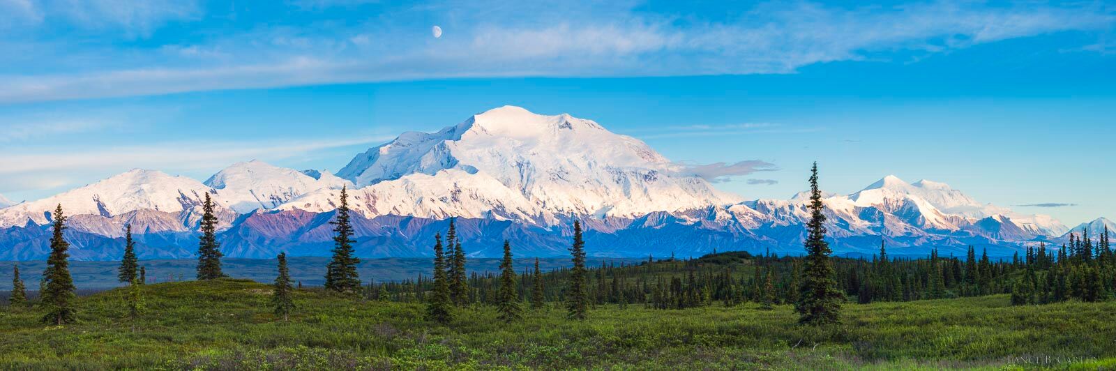 With a full moon highlighting the Mt Denali another spring day with long ours finds its a way into the dimmer light of the late...