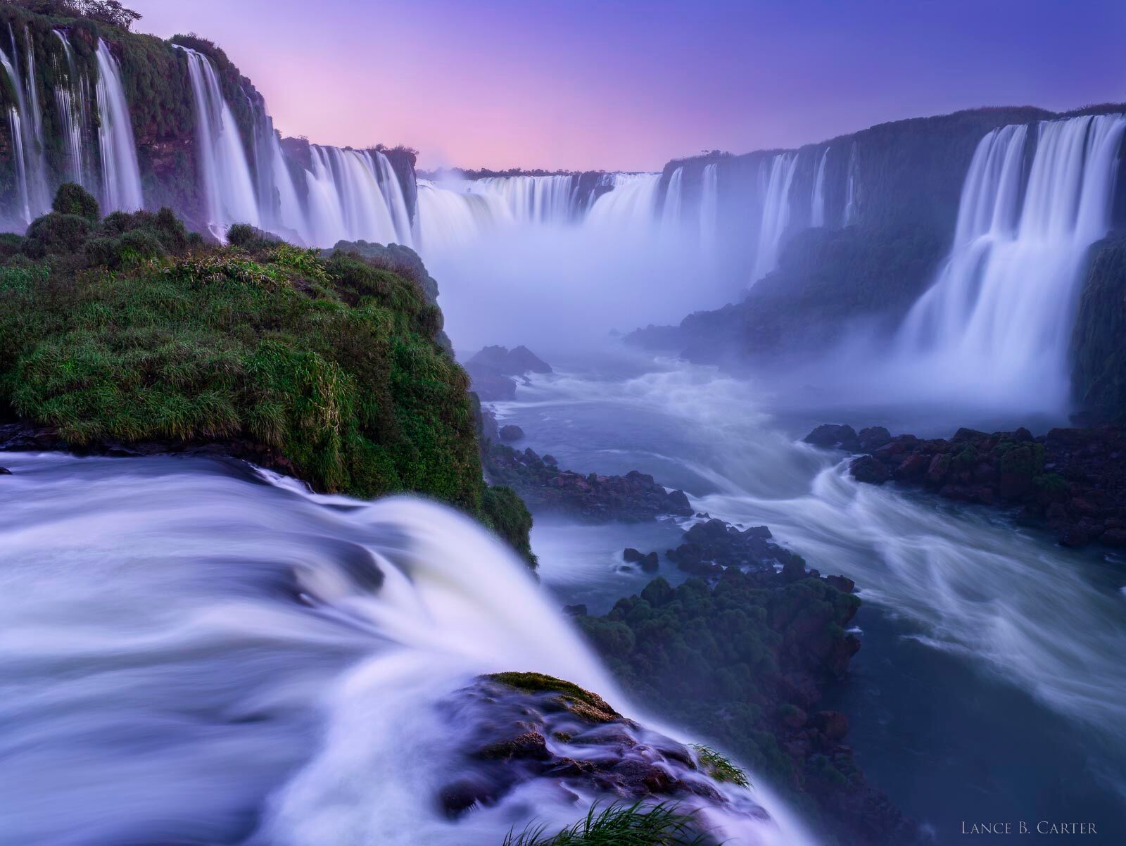 Catching the last light of the day, the water roaring over this seemingly endless falls reminds us of our smallness and the just...