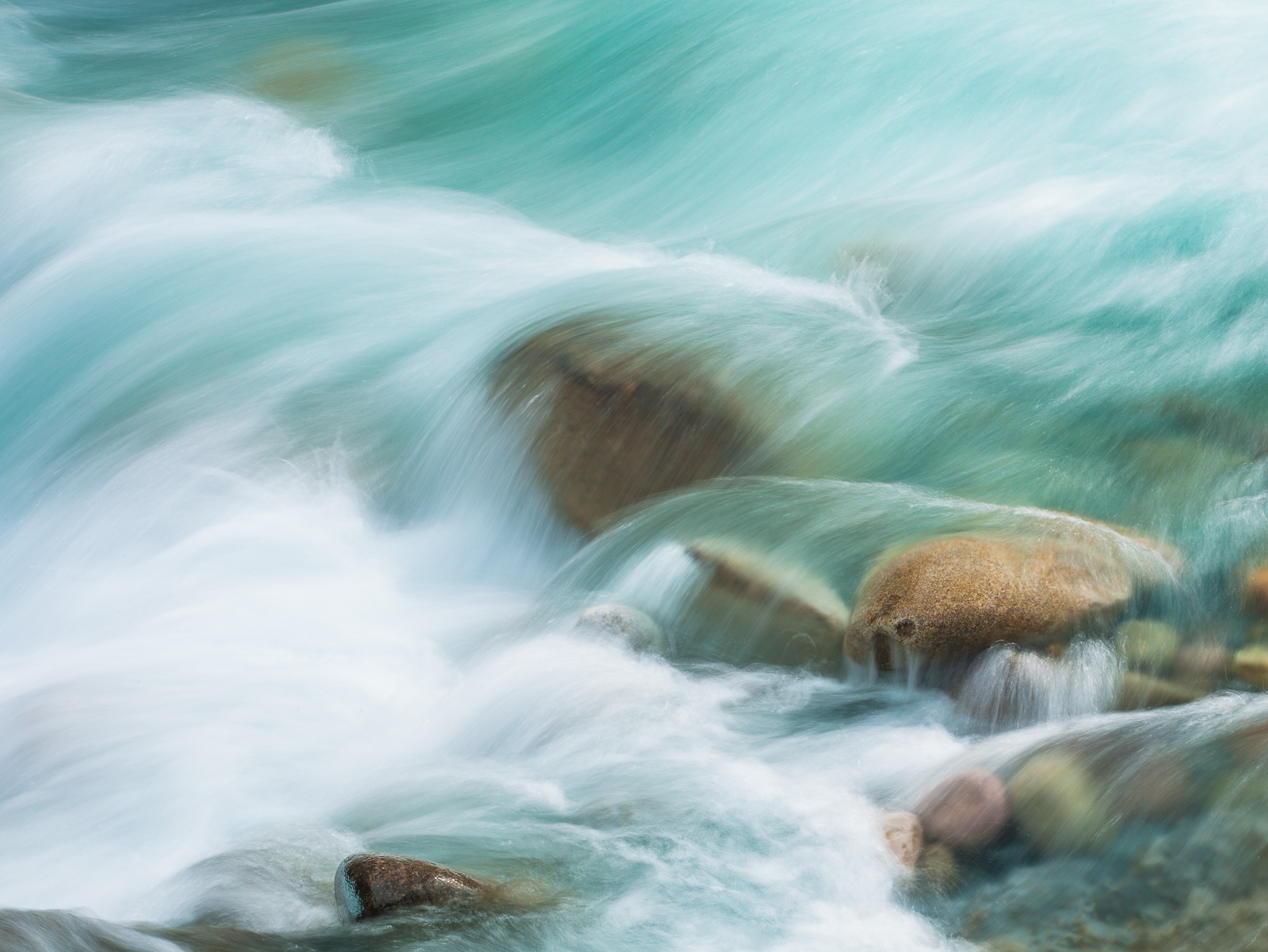 Cool colors of the glacier waters from the Canadian Rocky Mountains. Clean fresh water flows through the streams and bring a...