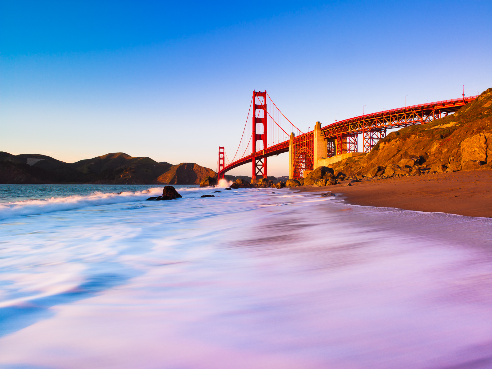 Do to the winter position of the sun if you time it correctly the Golden Gate bridge and shoreline light up with the red glow...