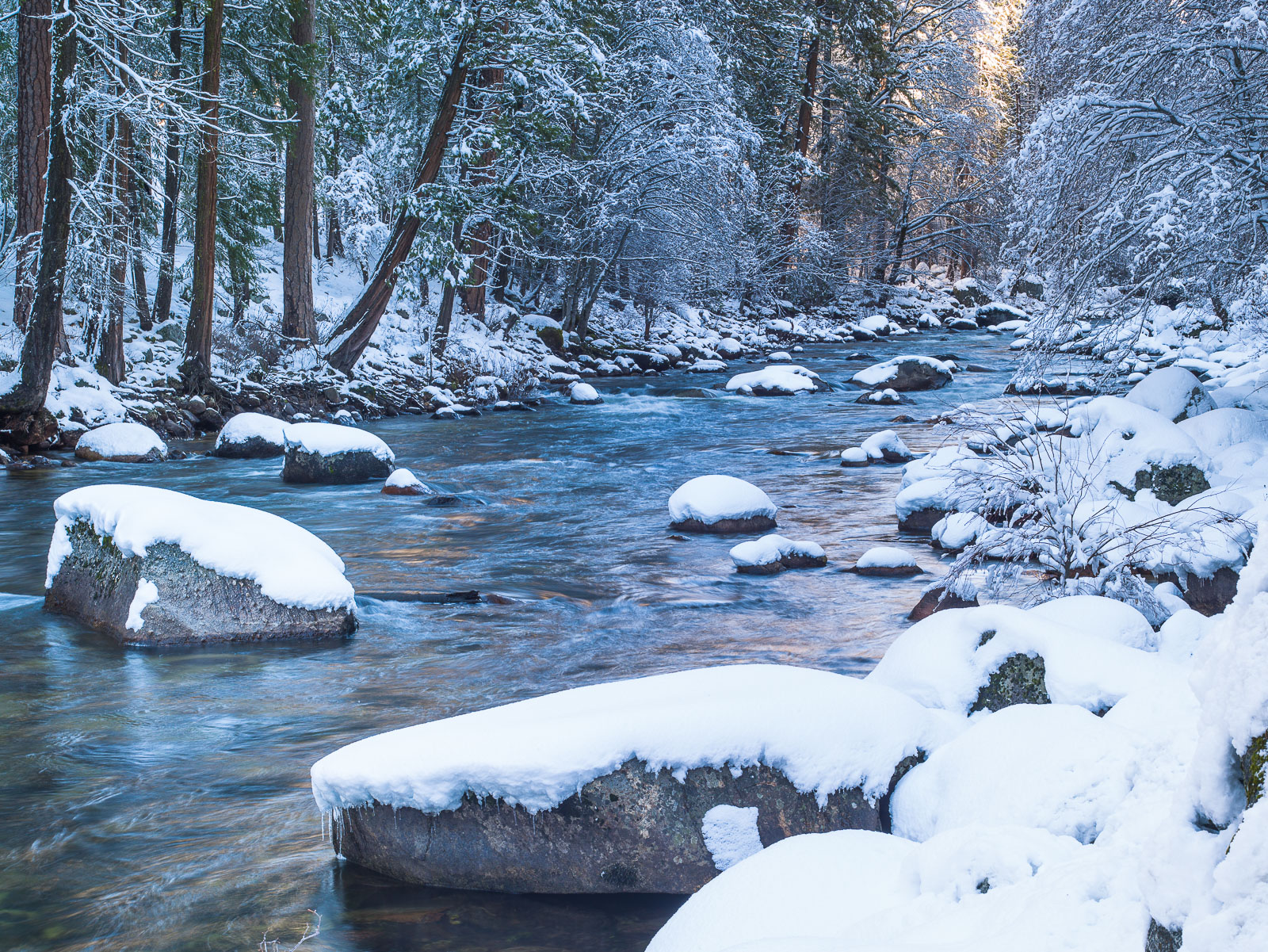 Yosemite Valley Merced River as the winter sun starts to chase away the shadows.