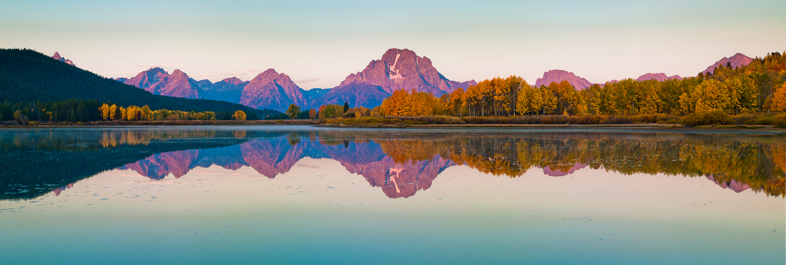 First morning light hits the Tetons with a warm pink glow. Calm waters greet the fresh air of autumn. Can you hear the sand hill...