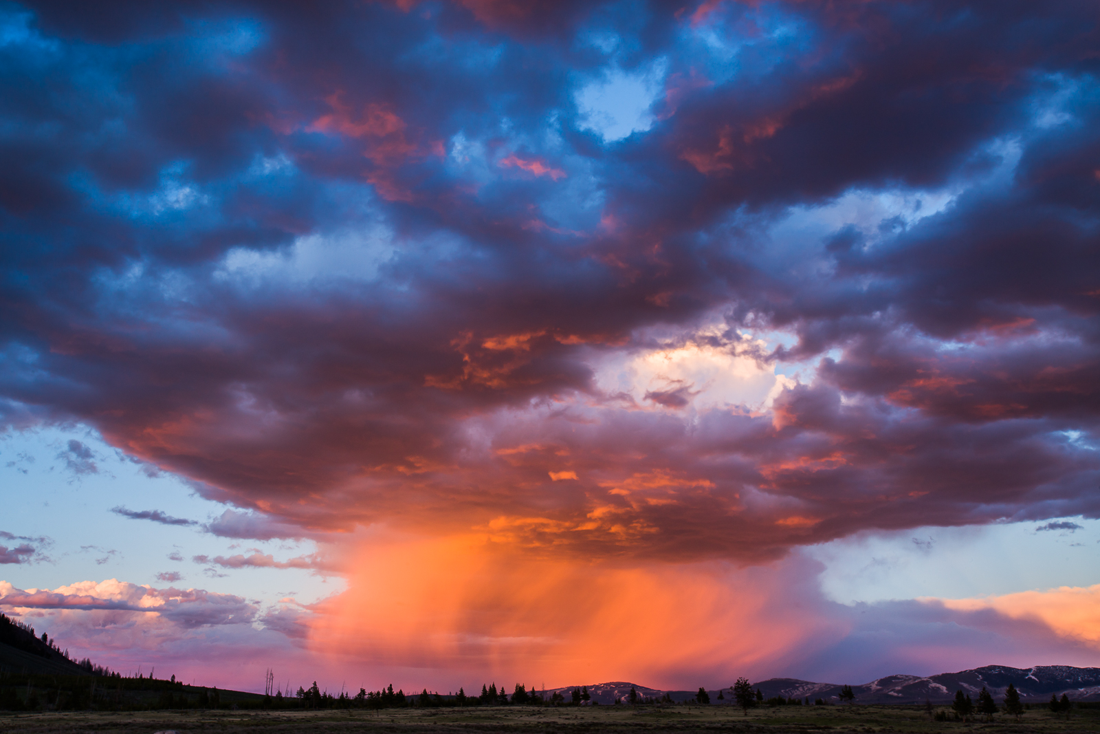 On coming rain storm catches the last light of the day in northern part of Yellowstone National Park.    Spring rains bring fresh...